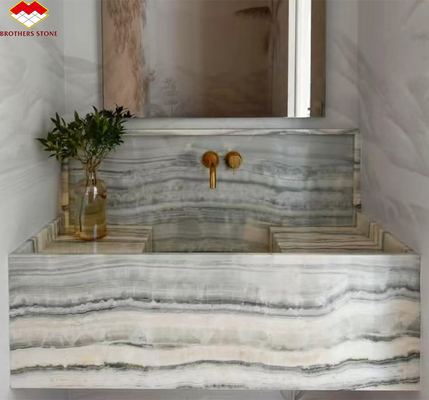 Hotel badkamer wandpaneel en vanity bassin met wasbak gemaakt van natuursteen onyx marmer