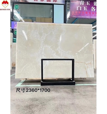 Doorzichtige witte onyx marmer grote plaat achtergrondverlichting rode/gouden aders voor hoteldecoratie